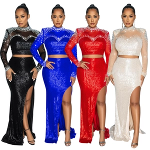 Detail of sequin mesh long sleeve crop top and high slit skirt set with pearls