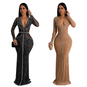 Detail view of shimmering rhinestones in wave patterns on slim long sleeve evening dresses