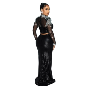 Detailed close-up of sparkling black sequins and rhinestone beadwork on evening dress