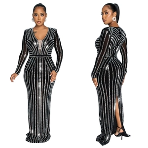 Detailed view of black long-sleeve evening gown with sparkling silver sequin geometric patterns