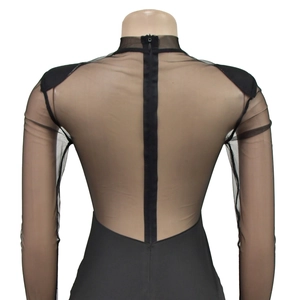 Detail of sheer mesh patchwork back with invisible zipper on long sleeve black bodysuit