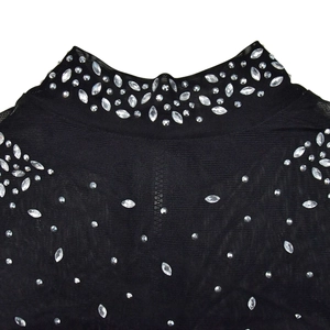 Detailed view of black mesh top with sparkling rhinestones and elegant high-neck design