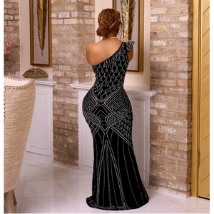 Elegant black one-shoulder fishtail evening gown with sparkling geometric rhinestone patterns