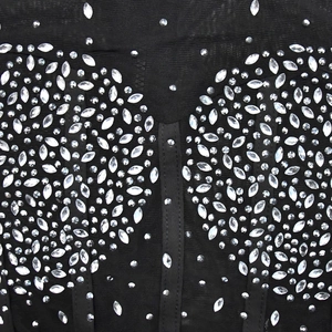 Detail of mesh fabric featuring intricate symmetrical rhinestones and crystal beadwork