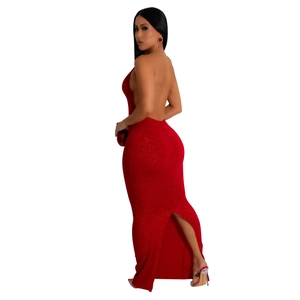 Detail of red backless halter dress showing side fit and rear slit on shimmering fabric