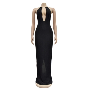Detail of black halter maxi dress with deep V-neckline and gold buckle accent