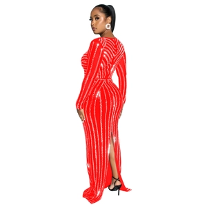 Detailed back view of red sequin gown showing the high slit and shimmering silver stripes