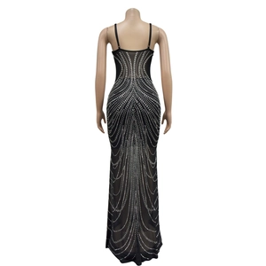 Detailed back view of a slim black mesh maxi dress featuring radiant rhinestone patterns