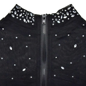 Detailed view of black mesh high neck top with sparkling rhinestones and a back zipper