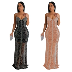 Detail of elegant sequin mesh evening dresses with slim fit fish tail design and rhinestones