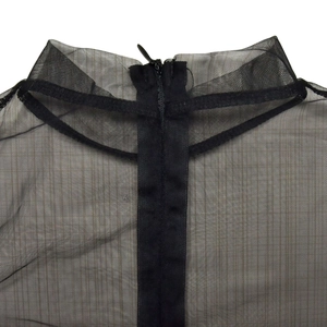 Detail of sheer black mesh dress featuring a chic high neck and a hidden back zipper closure