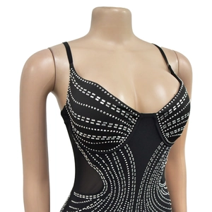 Detail of black mesh jumpsuit with sparkling silver rhinestones and sheer side panels