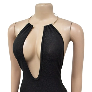 Detailed close-up of a black deep V-neck bodysuit with a gold ring halter neck detail
