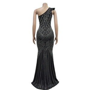 Detail of beaded geometric diamond pattern on black one-shoulder fishtail evening dress