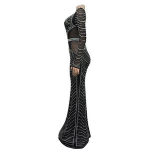 Detail of elegant black evening dress with sparkling rhinestones and mesh patchwork