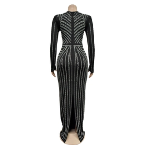 Detail of black long sleeve maxi dress with rhinestone geometric patterns and back zipper