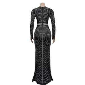 Rear view of black mesh evening gown featuring silver rhinestone wave patterns
