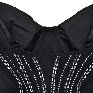 Detail of adjustable straps and silver rhinestone patterns on a black mesh dress
