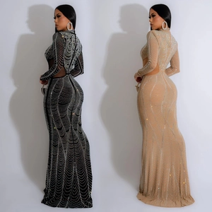 Detail of sheer mesh long sleeve dress featuring wave rhinestone patterns and back cut-out