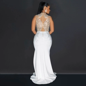 Exquisite back detail of white mesh evening gown with silver rhinestones and high neck design