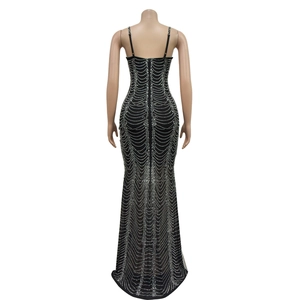 Detailed back view of a slim-fit evening gown with mesh sequins and wave patterns