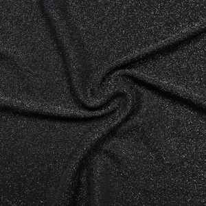 Detail of black glitter fabric with silver sequins for women long backless dress