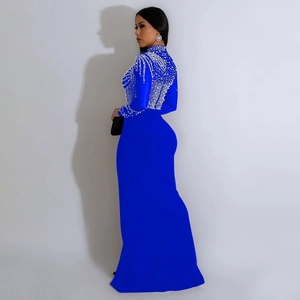 Detailed view of the sparkling rhinestone embellishments on a royal blue evening gown