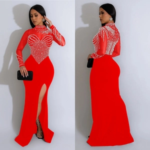 Elegant red high neck evening gown with sheer mesh bodice, white beads, and side slit