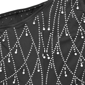 Detailed view of black fabric with rhinestones and pearls in a geometric diamond pattern