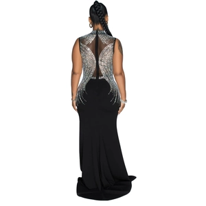 Close-up of elegant mesh back with silver rhinestones on a black evening gown