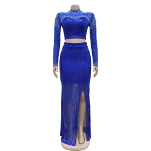 Detail of royal blue sequined two-piece evening dress with beadwork and mesh slit skirt
