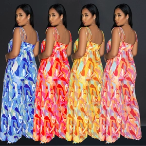 Detail showing various color variants of pleated wide leg jumpsuits with floral prints