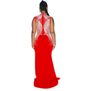 Close-up of sheer mesh back panel with silver rhinestone accents on a red evening gown