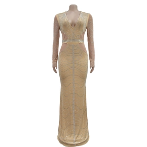 Detail of sheer mesh waist and silver rhinestone geometric patterns on long sleeve gown