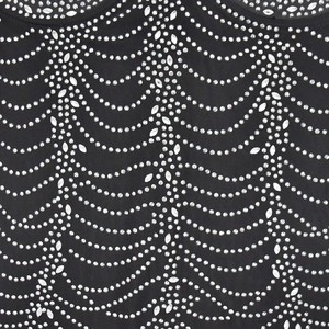 Close-up detail of silver rhinestones in wave patterns on black mesh evening dress