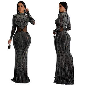 Detail of black evening gown with silver rhinestones and sheer mesh waist cutouts