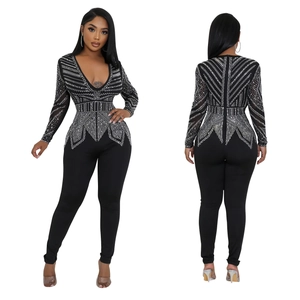 Women's slim fit black V-neck jumpsuit with long sleeves and silver rhinestone patterns