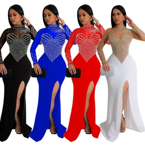 Detail of evening gowns featuring sheer mesh, rhinestone heart patterns, and side slits