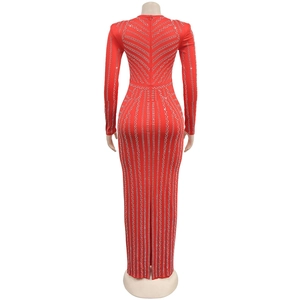 Detail of red floor-length evening dress with silver rhinestones in a V-shaped back pattern