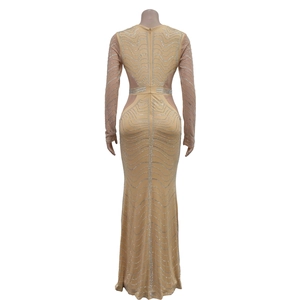 Detail of sheer mesh patchwork and sparkling silver rhinestone wave patterns on dress back