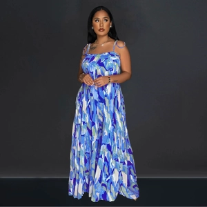 Detail of pleated wide-leg jumpsuit with colorful abstract floral print and spaghetti straps