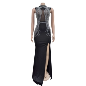 Detail of high-neck evening dress featuring silver rhinestones and mesh patchwork
