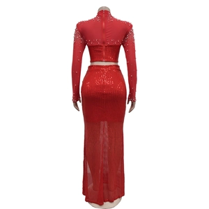 Detail of red mesh sequin dress set showing back zipper closure and pearl accents
