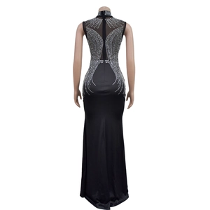 Close-up of mesh back with silver rhinestone patterns on this black evening dress