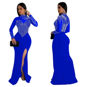 Detail of royal blue bodycon dress featuring rhinestone embellishments and side slit