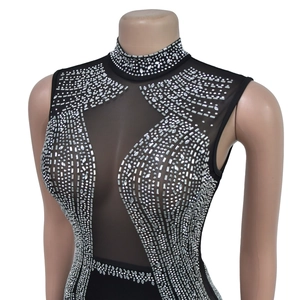 Detail of high neck black mesh bodysuit with silver rhinestones in geometric patterns