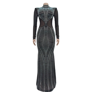 Detail of black evening gown featuring silver rhinestones and sheer mesh waist cutouts