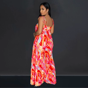 Detail of adjustable straps and elastic shirring on the back of a colorful printed jumpsuit
