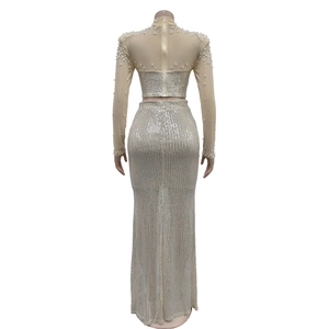 Detail view of mesh top with hand-stitched pearls and sequins on the elegant evening gown