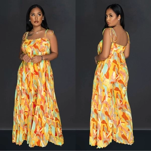 Women's chic wide-leg jumpsuit featuring vibrant abstract geometric print and spaghetti straps